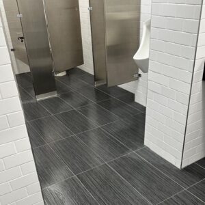 Tile and grout cleaning of restroom floor in NYC office space