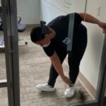 Cleaning glass door and glass partition in office space