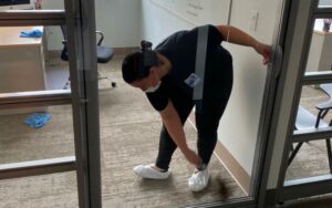 Cleaning glass door and glass partition in office space