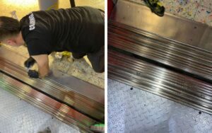 Deep cleaning elevator door steps in office building
