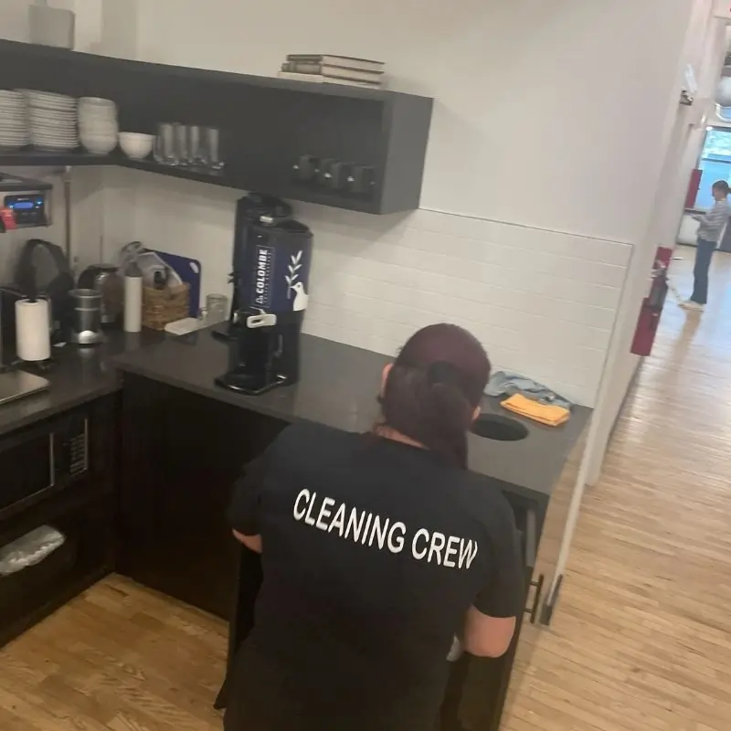 Collecting trash in tea kitchen in Manhattan office space