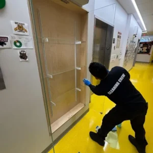 Glass cleaning on displays in NYC charter school