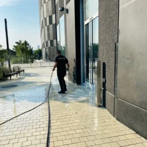 Pressure washing exterior walkway and grounds at NYC Astoria film studio