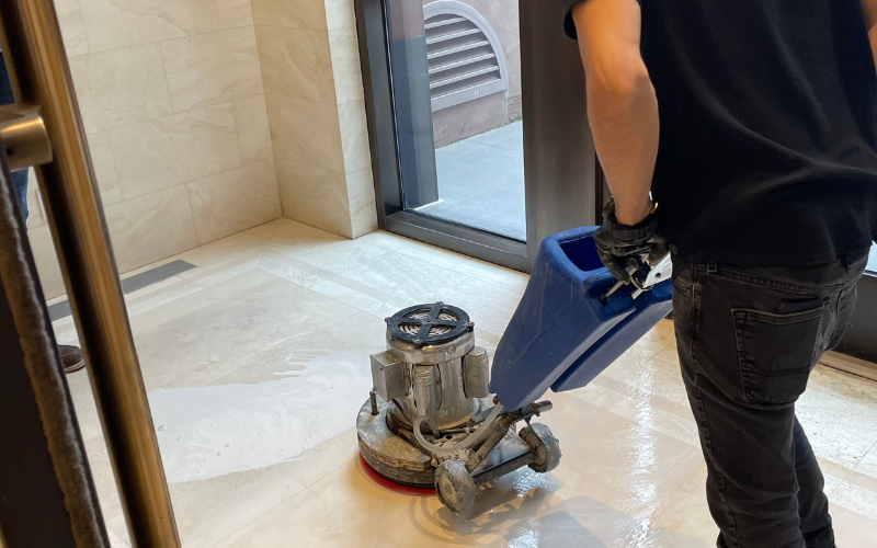 Cleaning a floor with mixed marble and tile