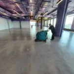 Final clean - concrete floor cleaning with auto scrubber post-construction in NYC office building