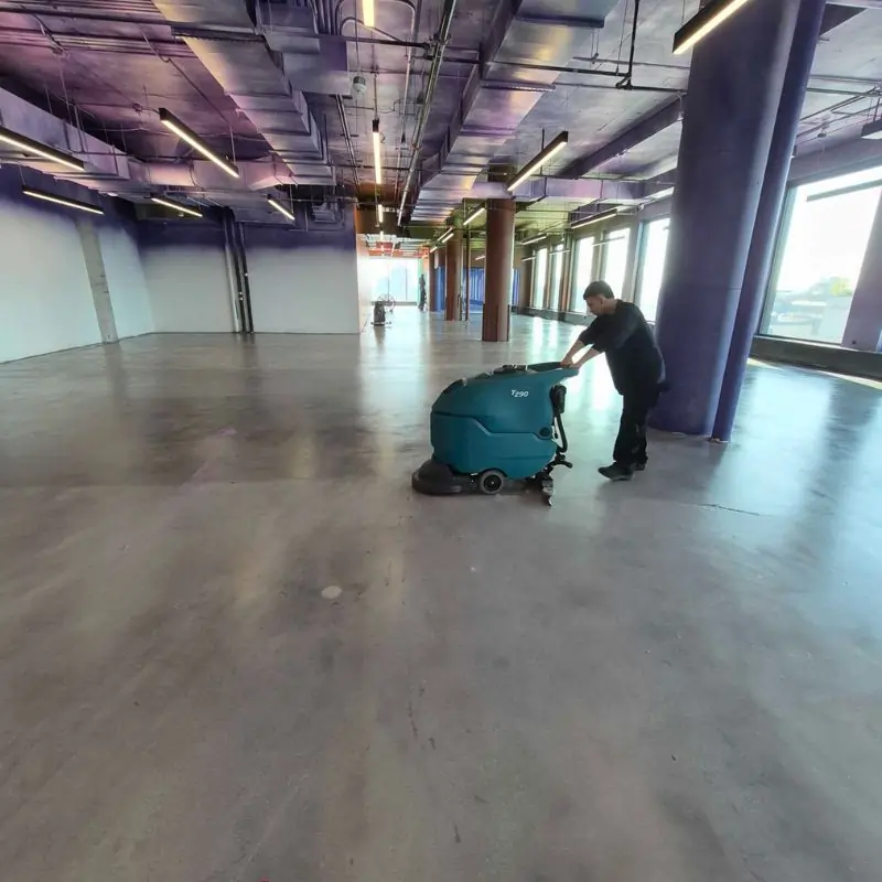 Final clean - concrete floor cleaning with auto scrubber post-construction in NYC office building