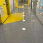 After Picture - Vinyl floor strip and wax in NYC charter school hallway after completion