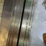 After picture - detailed cleaning of metal grid and floor of elevator at tourist attraction in Manhattan