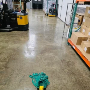 Before Picture - Concrete floor cleaning in NYC warehouse