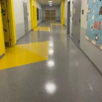 Before Picture - Vinyl floor strip and wax in NYC charter school hallway after completion