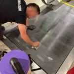 Before picture - cleaning metal grid at escalator landing in Tourist Attraction in Manhattan