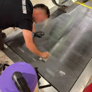 Before picture - cleaning metal grid at escalator landing in Tourist Attraction in Manhattan