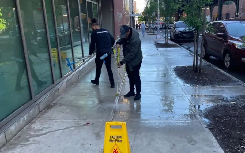Advantage Cleaning Crew pressure washing facade and sidewalk as preparation for NYC school reopening Advantage Cleaning Crew pressure washing facade and sidewalk as preparation for NYC school reopening