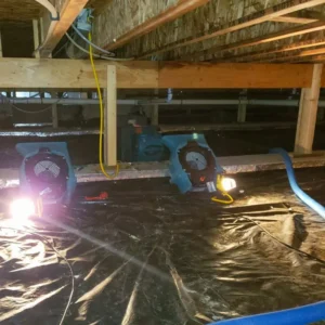 Humidifiers set up to dry after water damage to floor structure