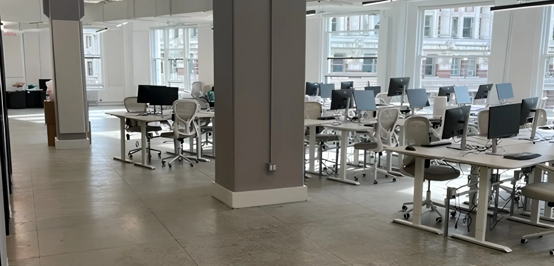 Cleaning of open office space with cement floors in New York City, mid-town Manhattan